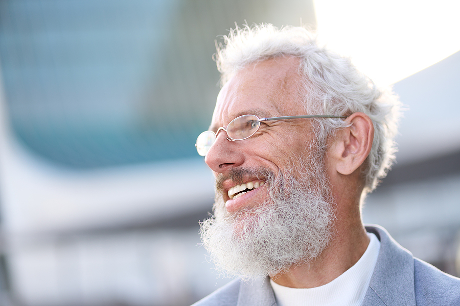 smiling senior without tooth loss - senior dental care